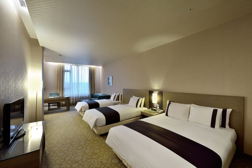 Business Quadruple Room | Down comforters, minibar, in-room safe, desk