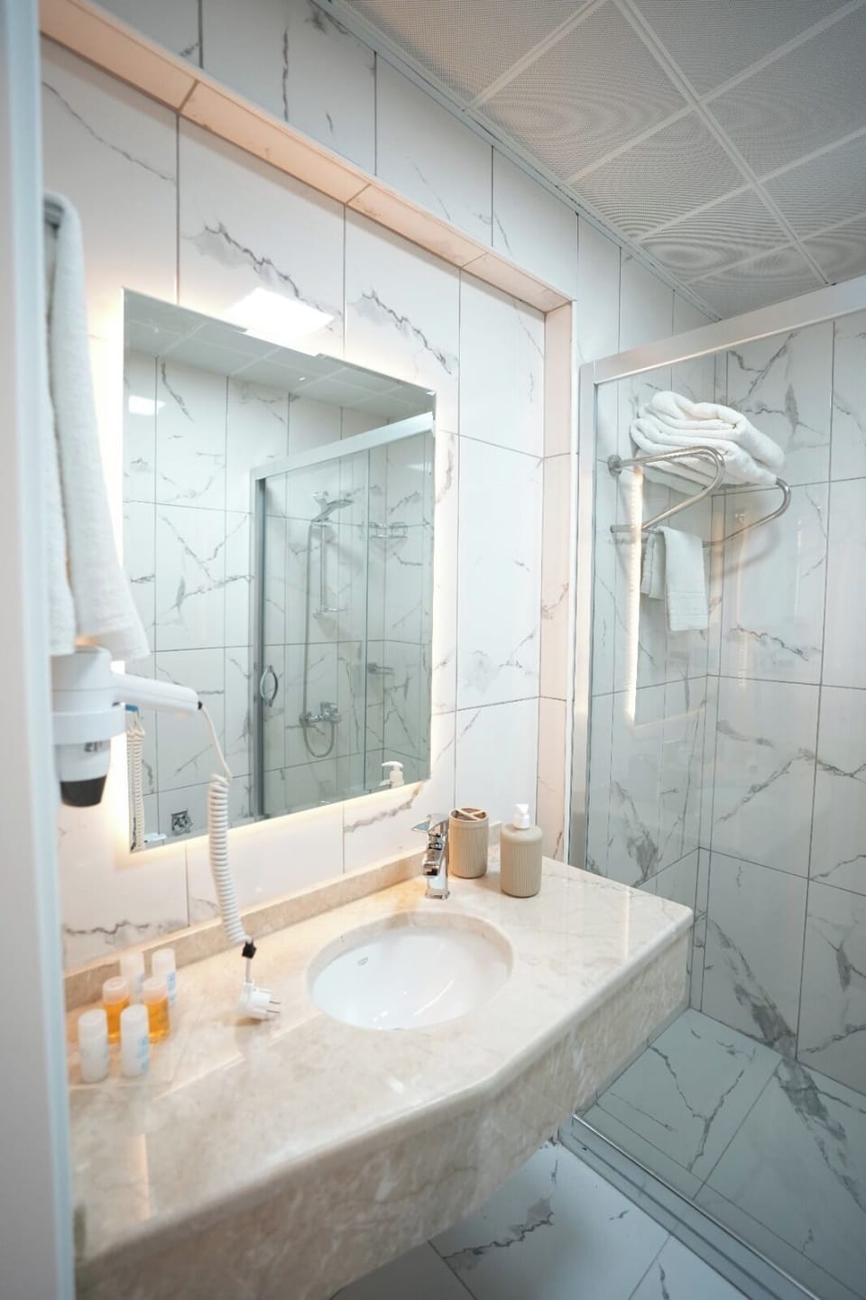 Shower, hair dryer, towels, soap