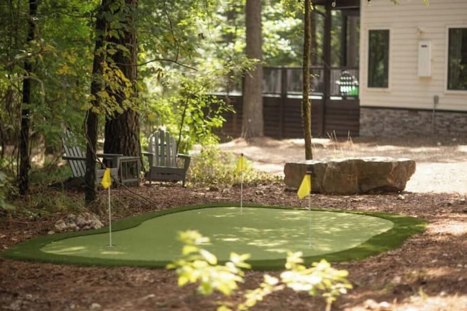 Custom sunken golf green is a guest favorite, With three tee boxes -FUN!!