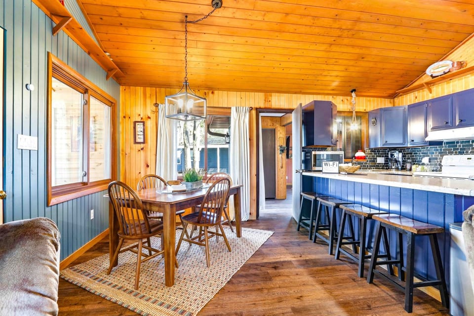 Spacious Kitchen with Blue Cabinets, Cozy Bar & Dining Table