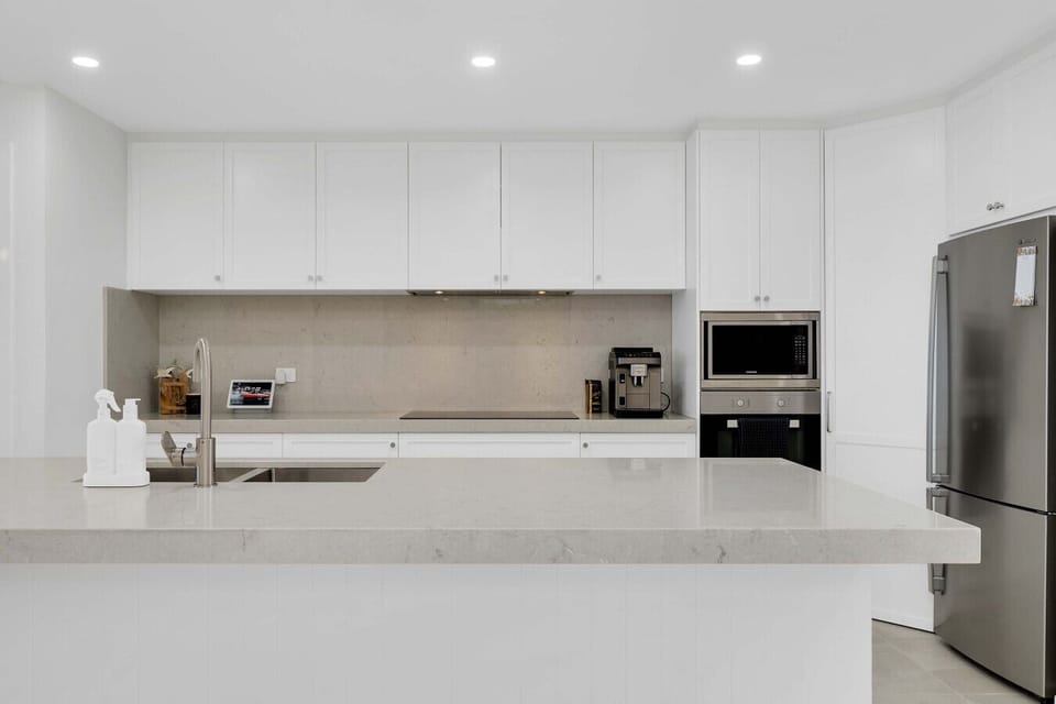 Modern kitchen with stone benchtops & European appliances