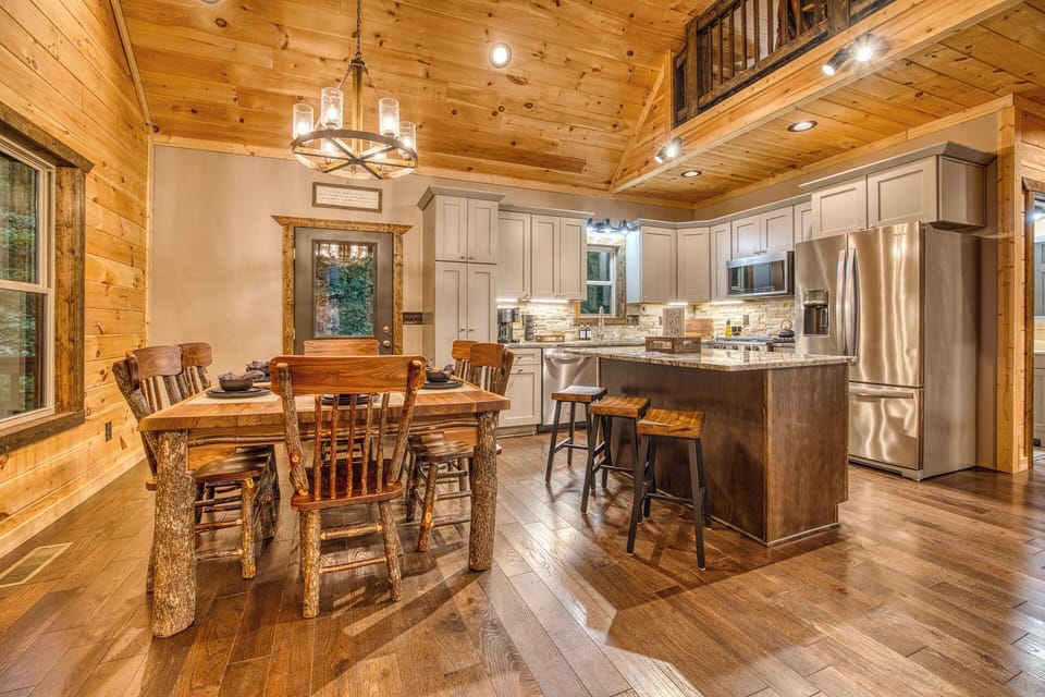 The modern kitchen opens up to the dining room and living room.