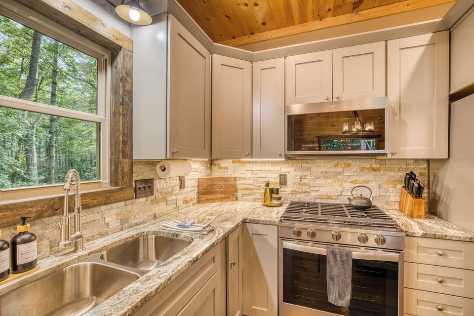 Our fully-equipped kitchen features quartz countertops, stainless steel appliances, and everything you could possibly need.