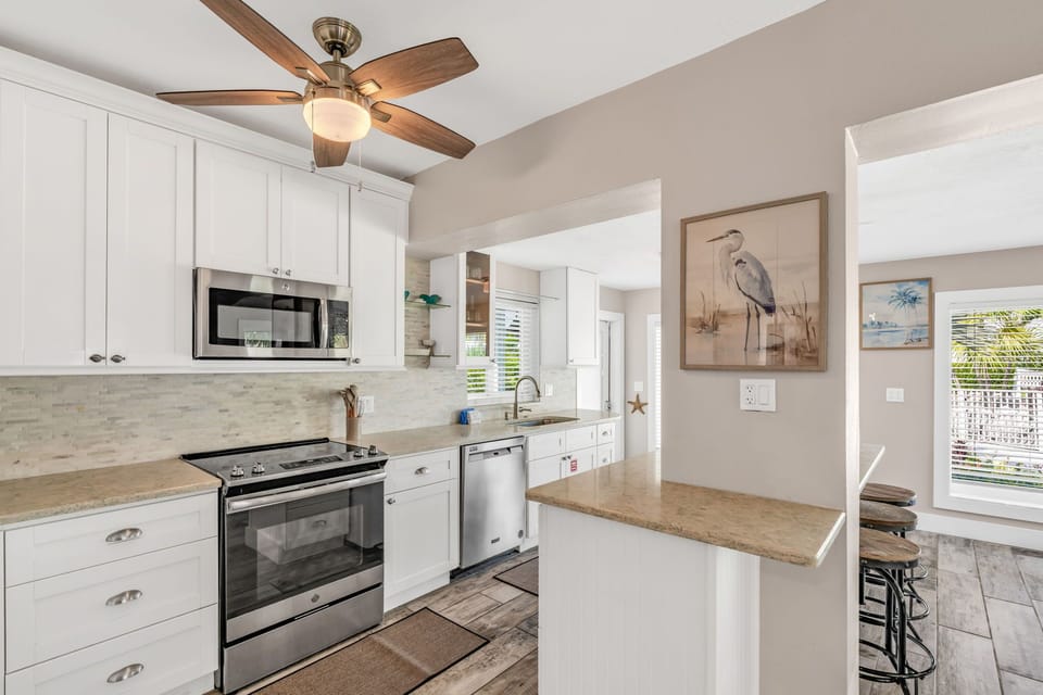 A chef's dream kitchen with granite countertops, stainless steel appliances, and breathtaking views of the Atlantic Ocean, all in a private Marathon vacation rental.