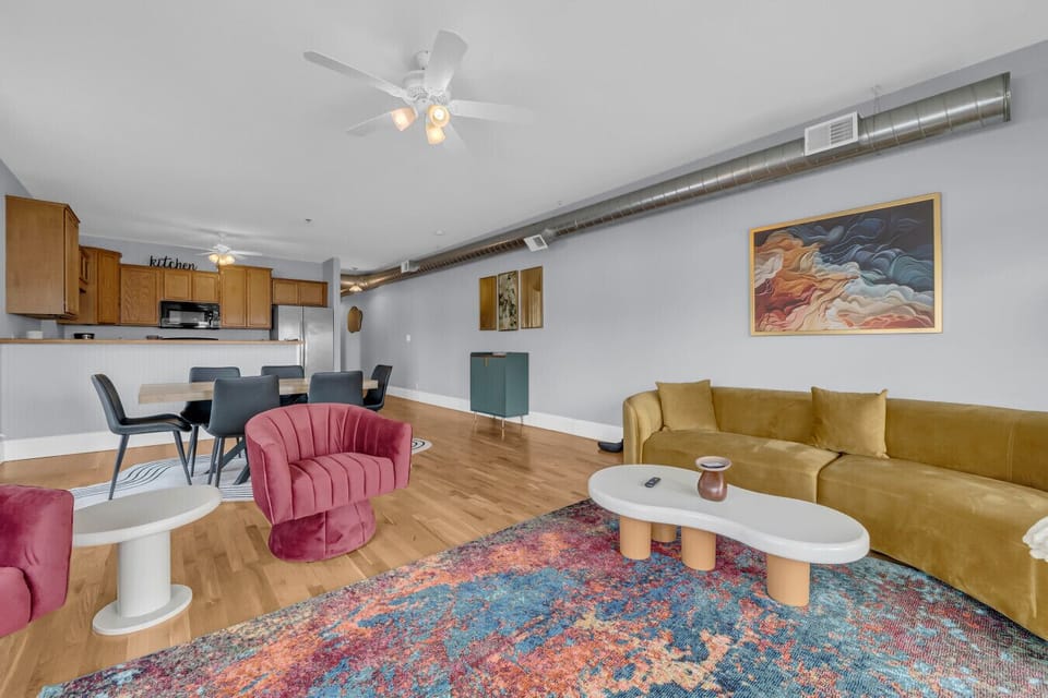 Modern, colorful, and just the right amount of artsy—this open-concept space is made for lounging, laughing, and takeout nights that turn into dance parties.