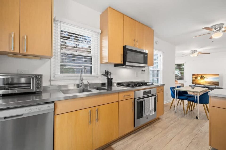Updated kitchen with stainless steel countertops and appliances