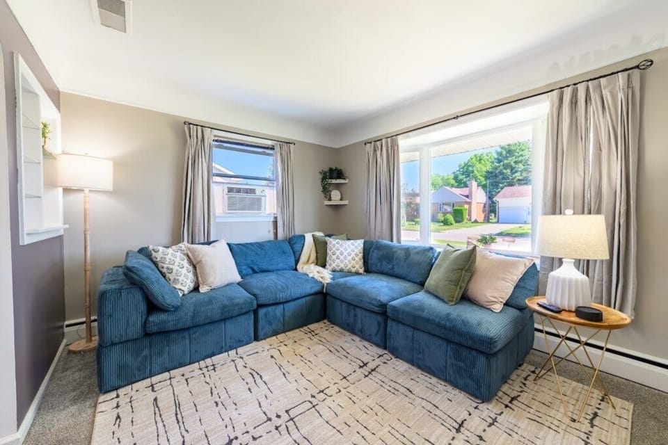 Relax on the sofa while enjoying the view of the lake right across the street. 