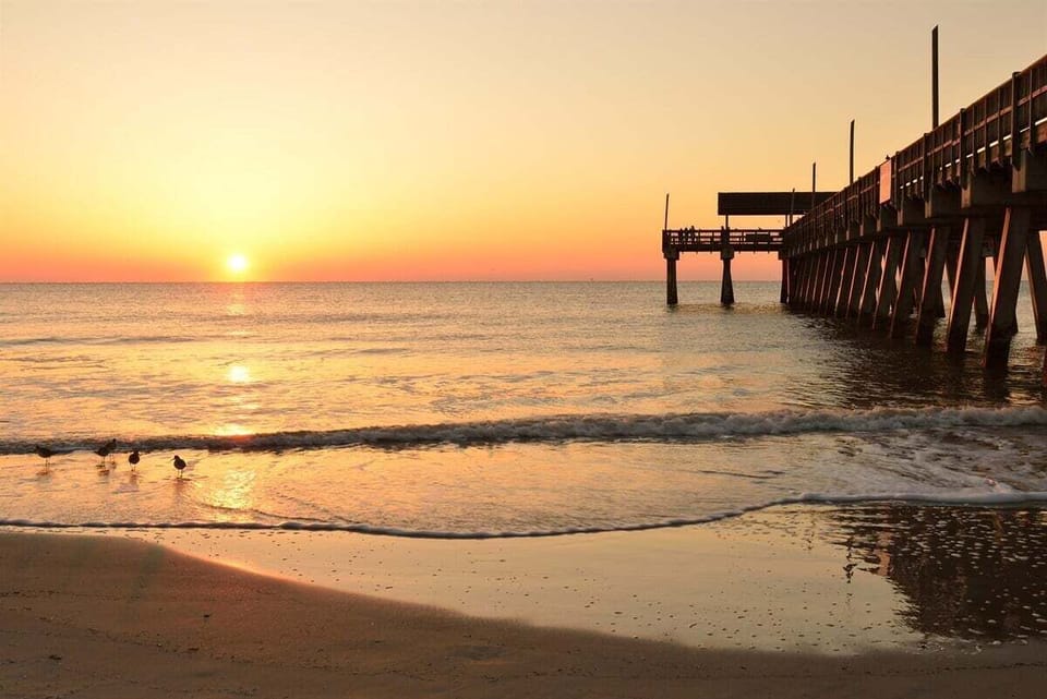Sun, surf, and endless skies — the perfect day at Tybee Island Pier.