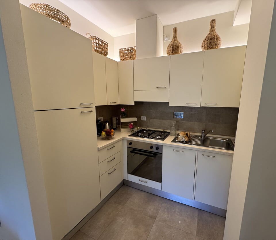 Kitchen, Kitchen Appliance, Major Appliance, Countertop, Flooring, Interior Design, Cabinetry, Floor, Stove, Kitchen Stove