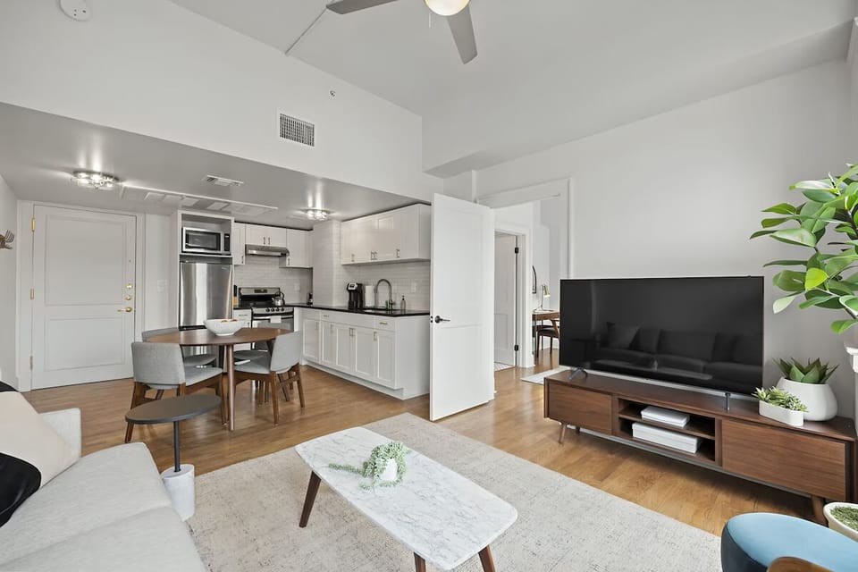 Lounge comfortably with high ceilings and sunshine streaming in.