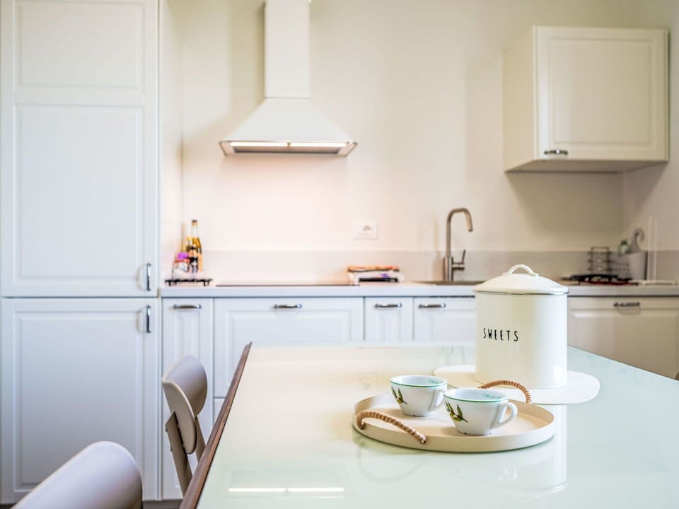 Interior Design, Kitchen, Countertop, Kitchen Appliance, Cabinetry, Lighting, Flooring, Furniture, Tap, Room