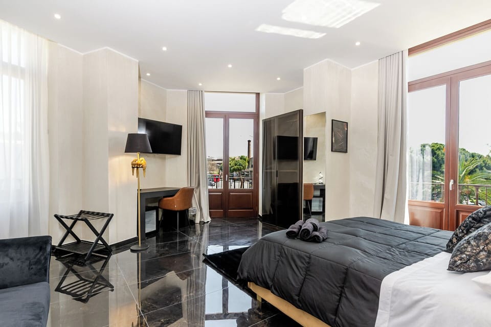 Deluxe Suite, Balcony, City View | Desk, laptop workspace, free WiFi