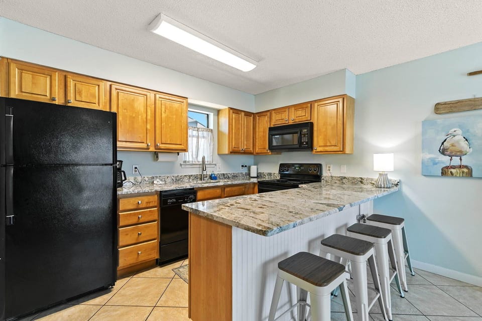 Living room meets kitchen bar seating - great for casual meals & morning coffee.