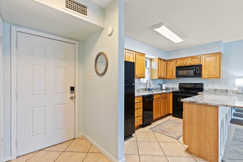 Entryway leads right into the kitchen for easy unloading of groceries and snacks