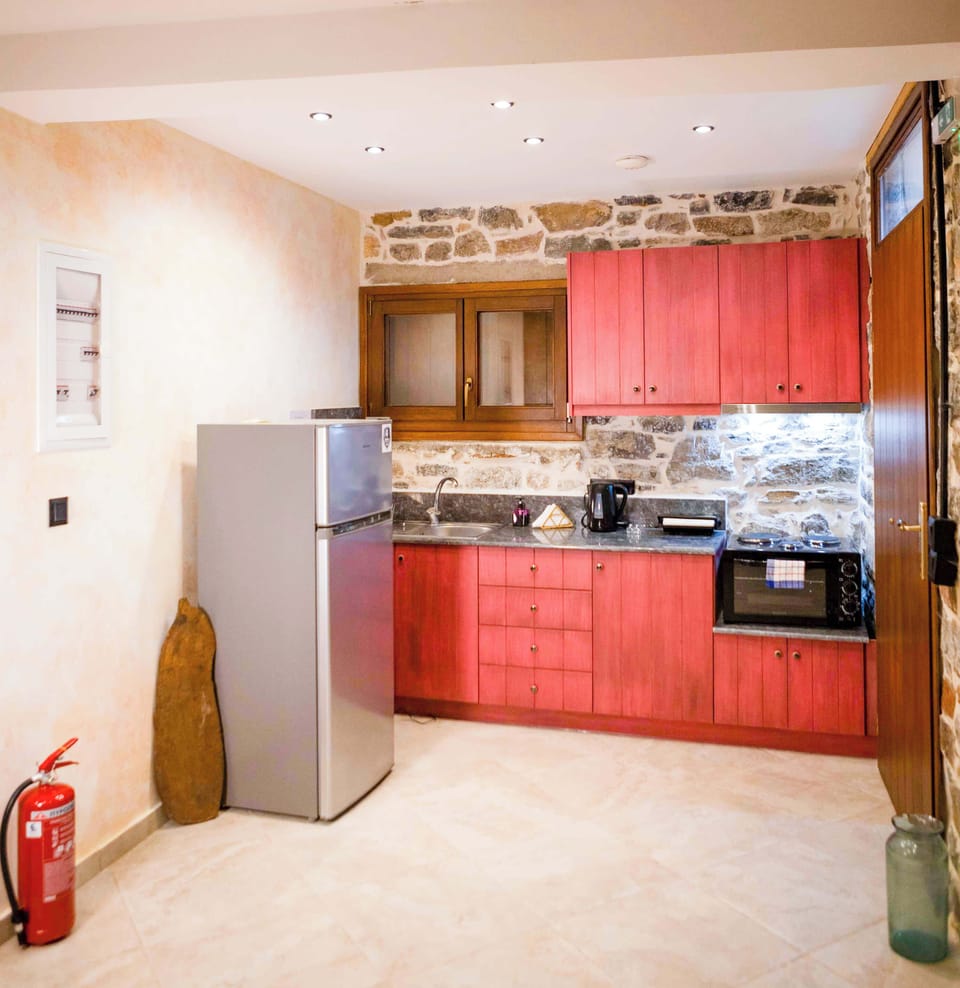 Kitchen Area with Dining Space and Stone Interior Details