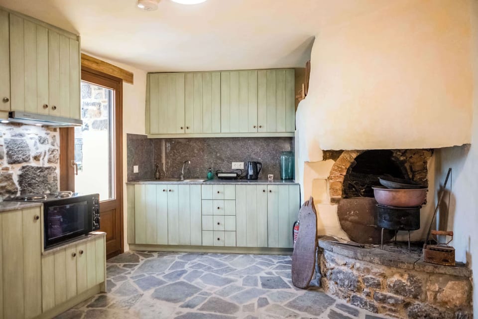 Fully Equipped Kitchen with Traditional Stone Details