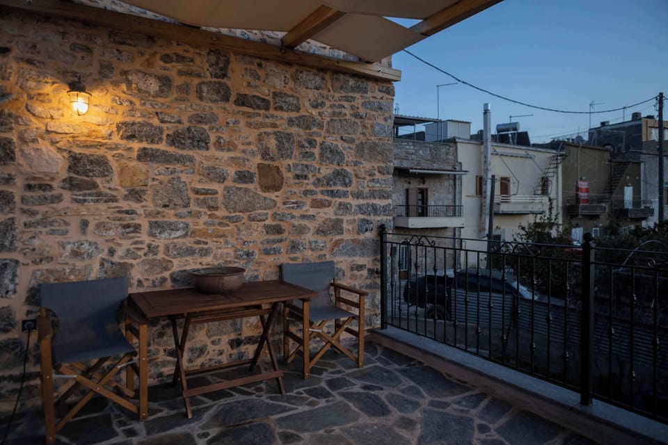 Outdoor Seating Area with Stone Exterior and Evening Lighting