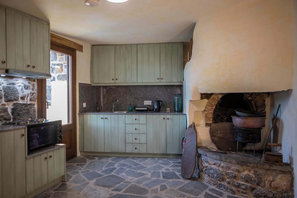 Fully Equipped Kitchen with Traditional Stone Details