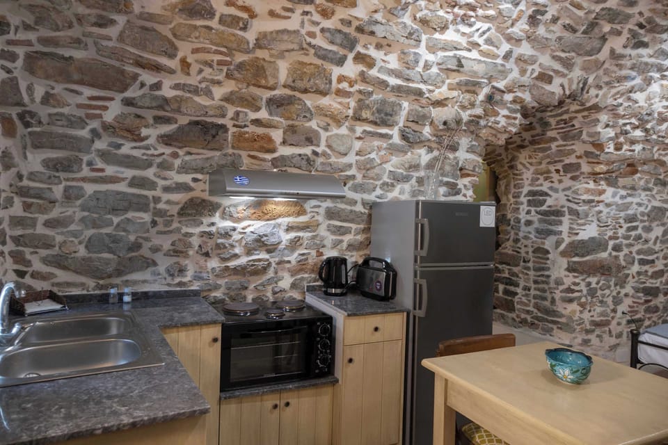Kitchen Area with Stone Walls and Cooking Facilities
