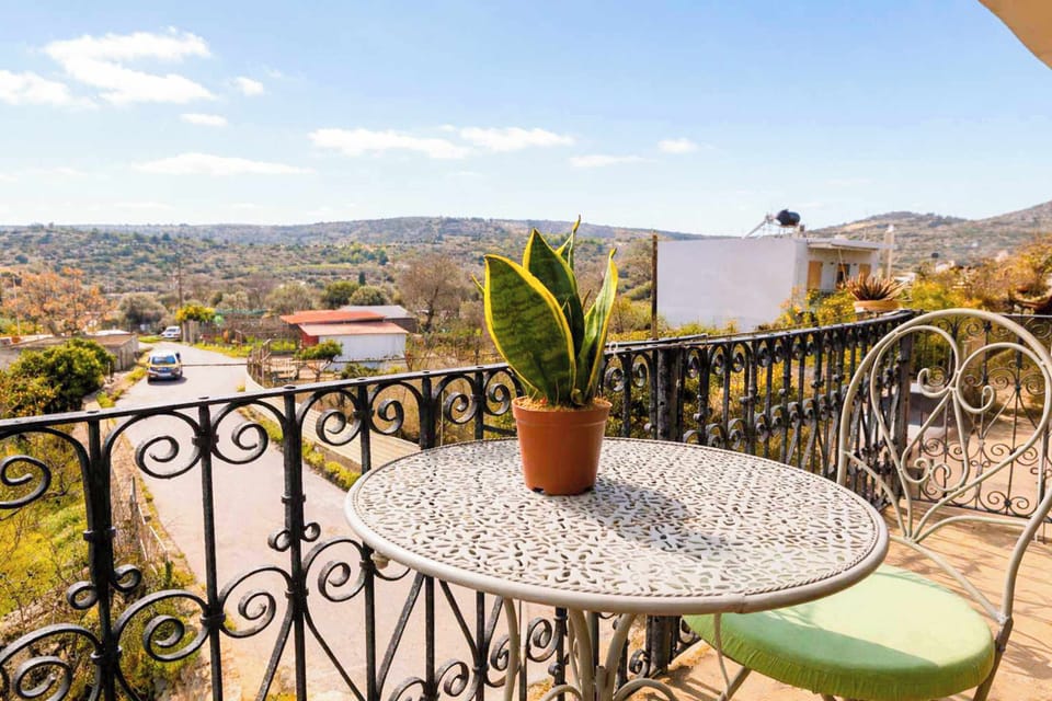 Outdoor Balcony Seating Area with Scenic Views of the Village and Countryside