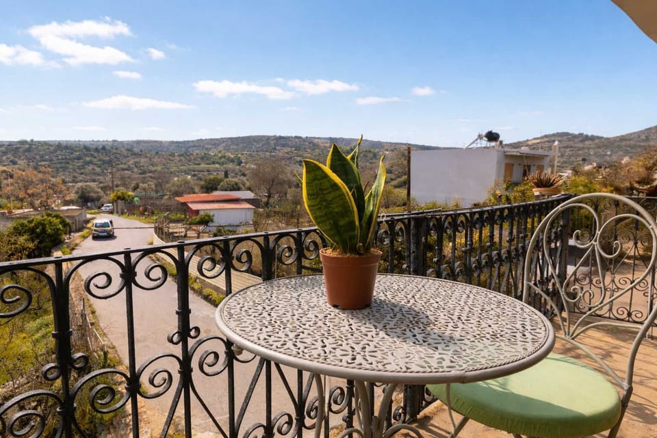 Outdoor Balcony Seating Area with Scenic Views of the Village and Countryside