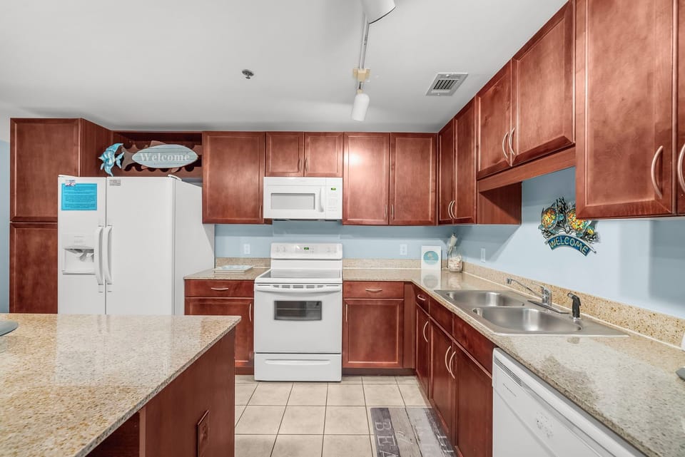 spacious kitchen with granite countertops and modern appliances