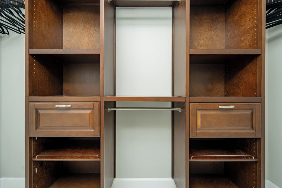Store your belongings in the master closet featuring ample shelving and a convenient hanging rod for easy organization