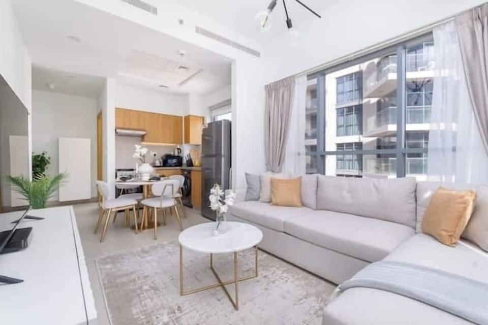 Luxury Apartment, City View | Living area | 65-inch Smart TV with cable channels