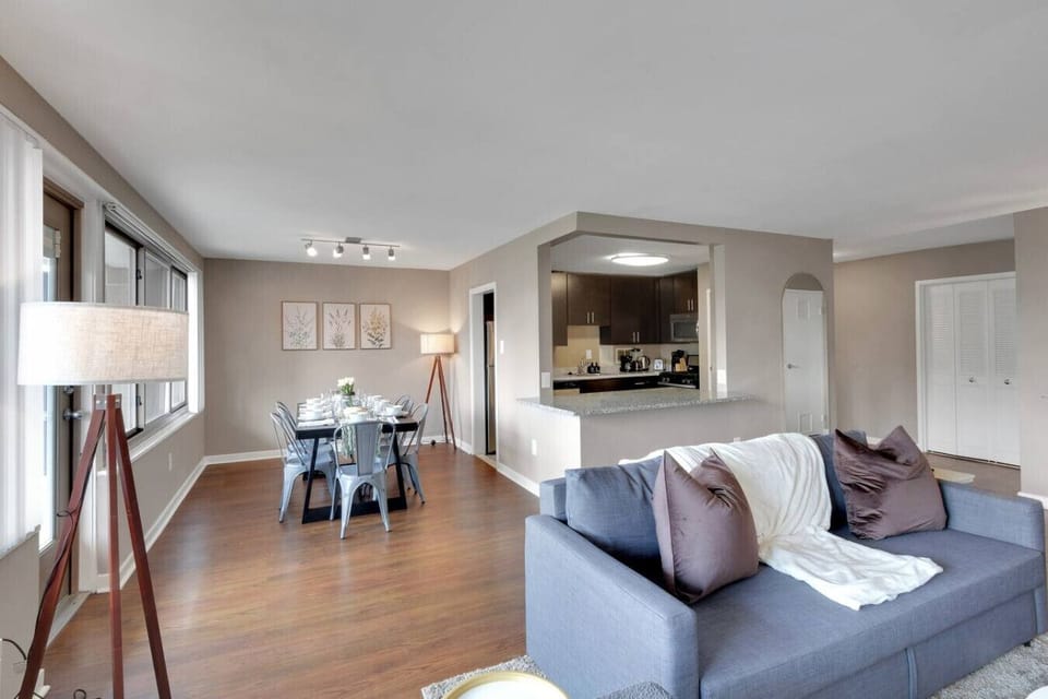 1,400 square feet of open living space with a connected kitchen, dining table for eight, and a living room that seats your whole group comfortably.