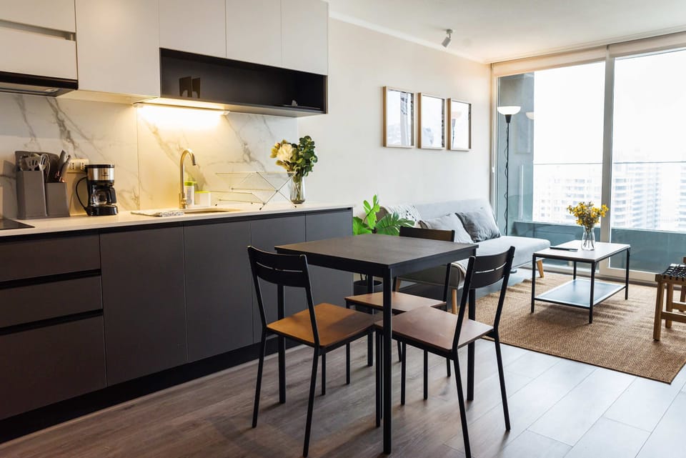 Chic studio with modern kitchen and cozy living space, perfect for a relaxing stay in the heart of the city.