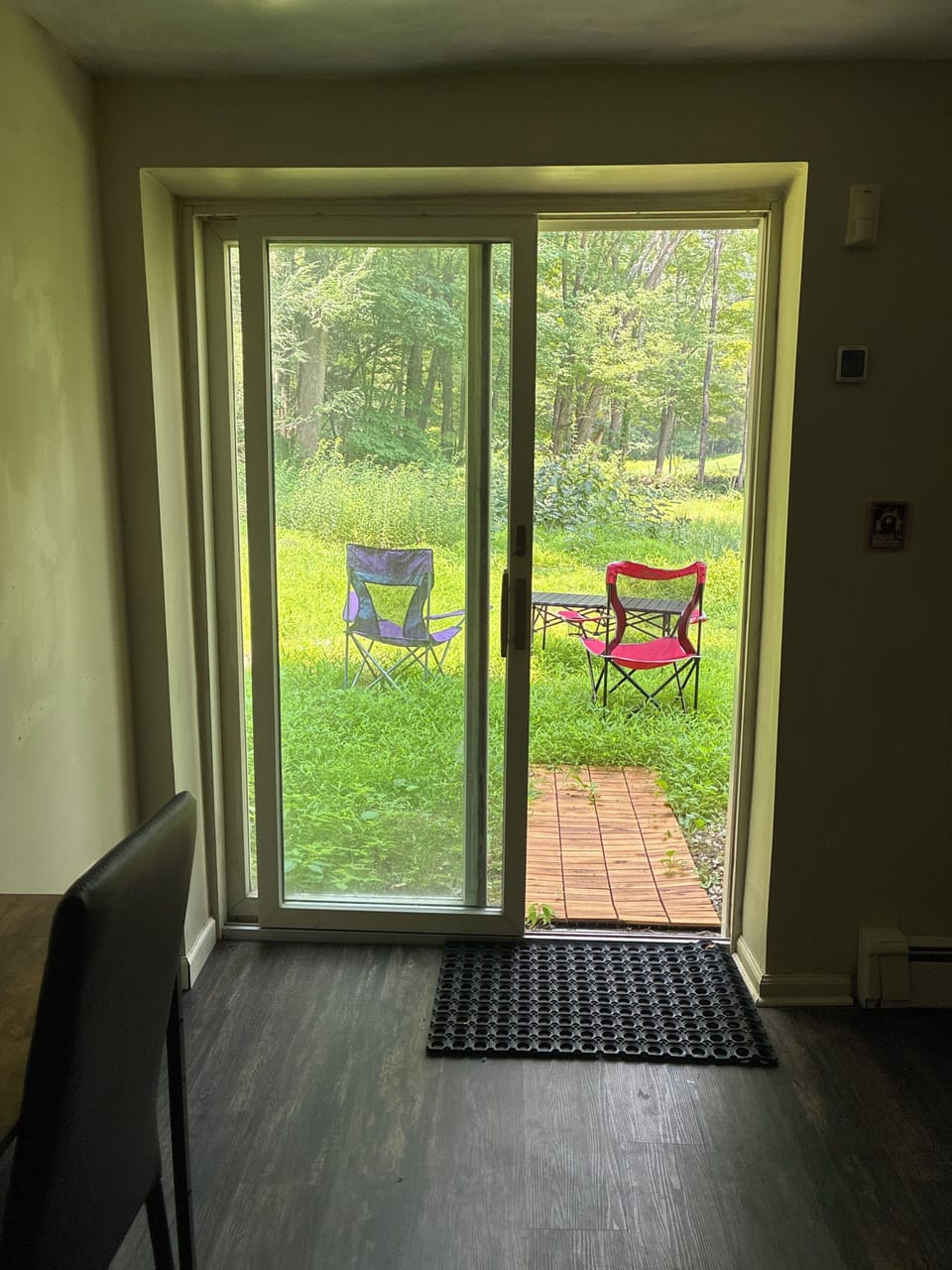 Access to backyard with sitting area and table