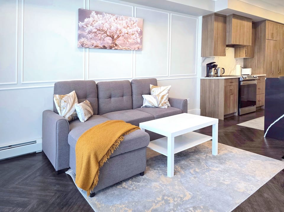 Spacious living room with sofa, downtown Calgary condo perfect for relaxing