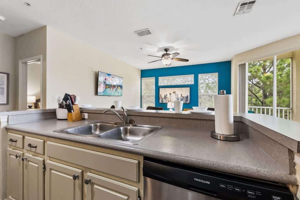 - Open concept kitchen, offering a seamless flow into the living space
- Enjoy a fully equipped setup with a spacious countertop, bar seating, & a bright atmosphere
- Large windows & a balcony view make every meal prep feel refreshing and enjoyable