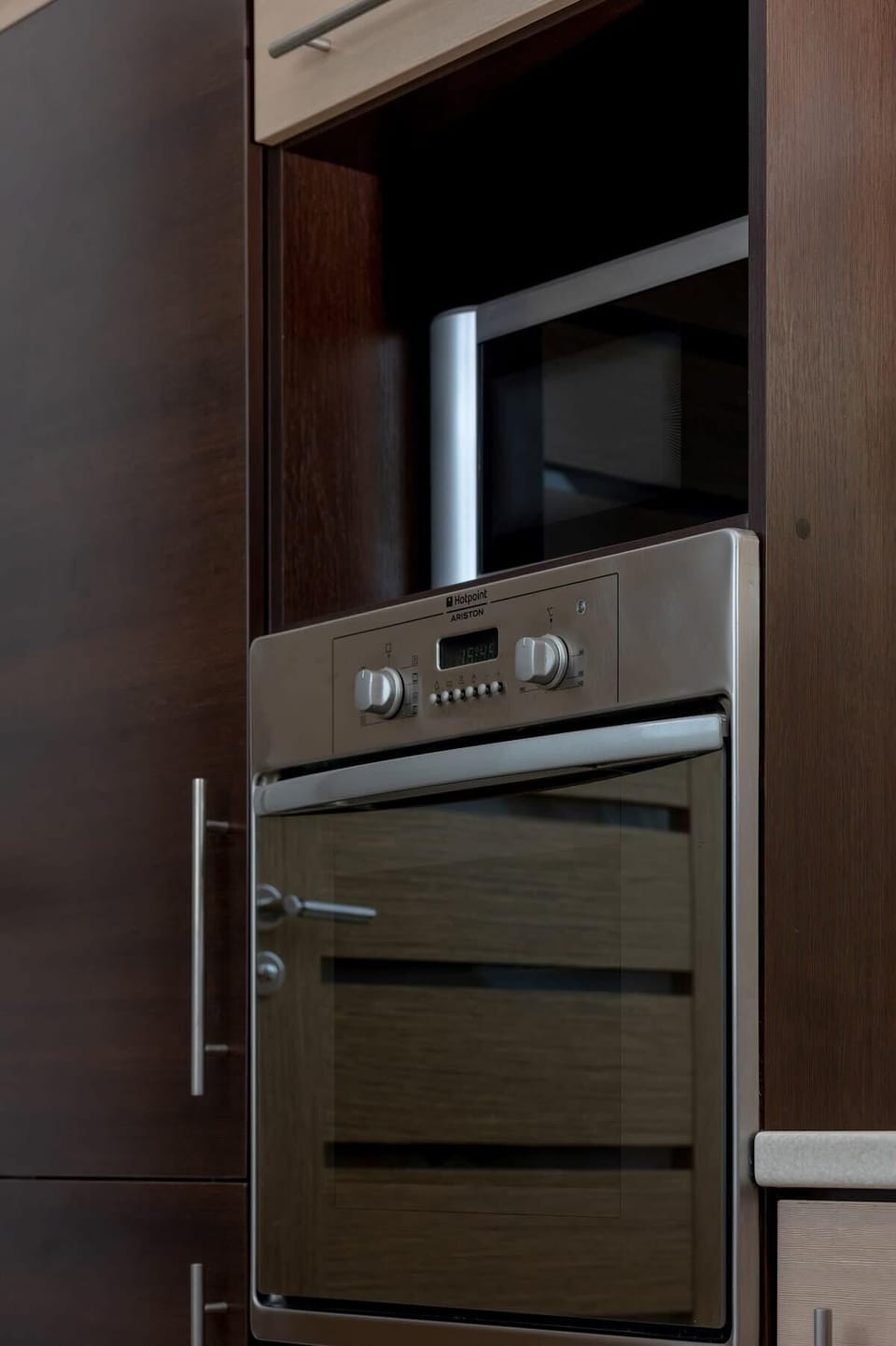 High-quality oven built into minimalist cabinetry, underlining the kitchen's modern character.