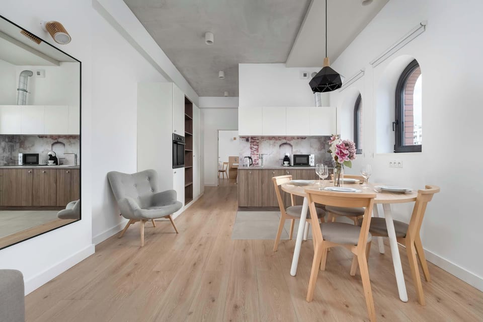 The living room's modern and stylish decor creates a welcoming atmosphere.