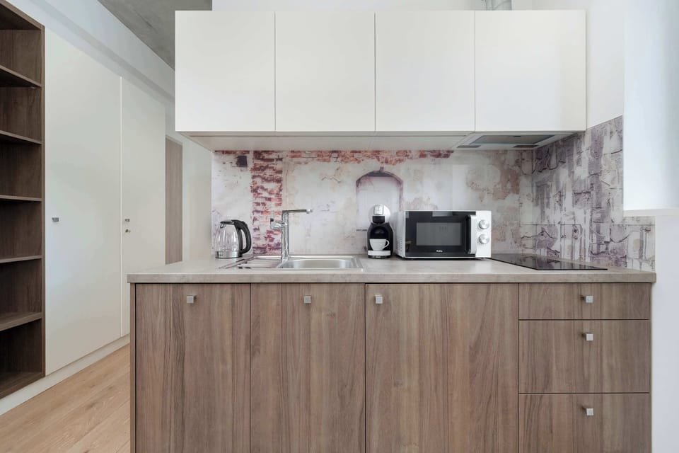 The fully equipped kitchenette includes everything you need for a home-cooked meal.