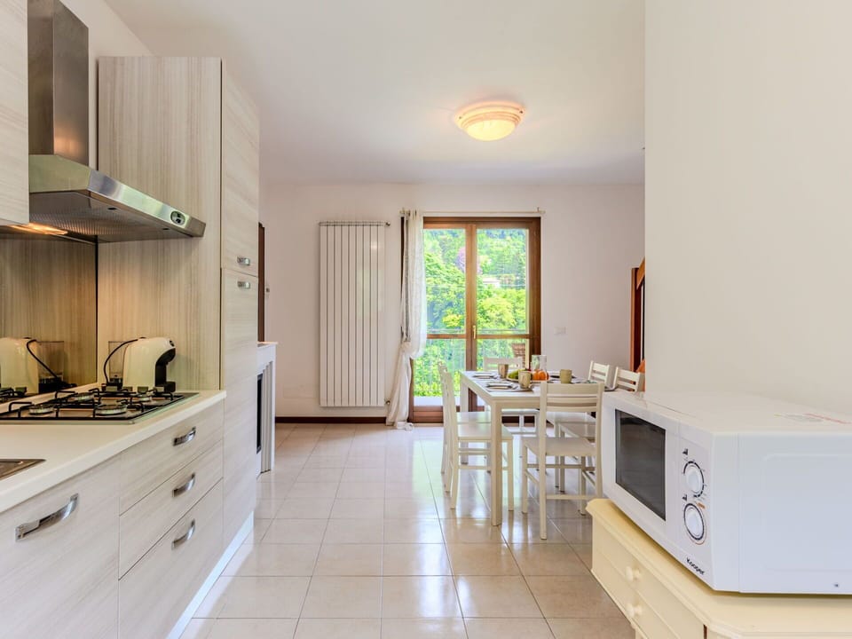 Interior Design, Flooring, Kitchen, Wood, Countertop, Furniture, Floor, Room, Cabinetry, Ceiling
