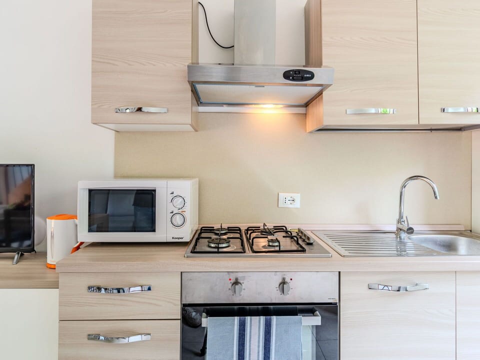 Kitchen, Kitchen Appliance, Countertop, Major Appliance, Cabinetry, Wood, Kitchen Sink, Furniture, Kitchen Stove, Interior Design