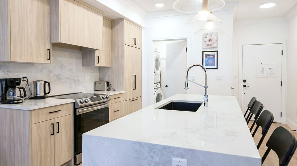 Open concept kitchen, island seating, modern condo, fast WiFi, Calgary
