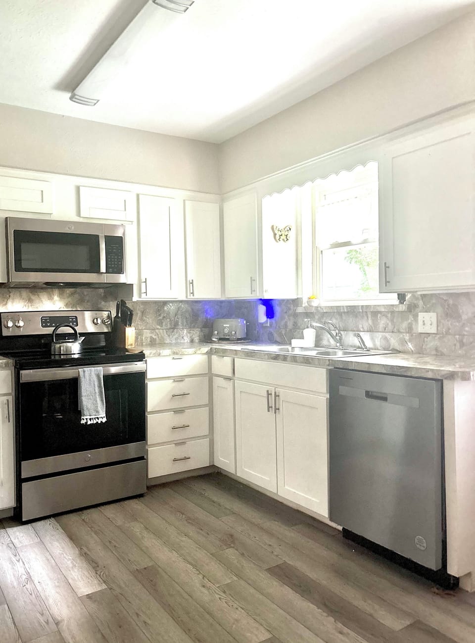 Kitchen with new appliances and all essentials for cooking or baking