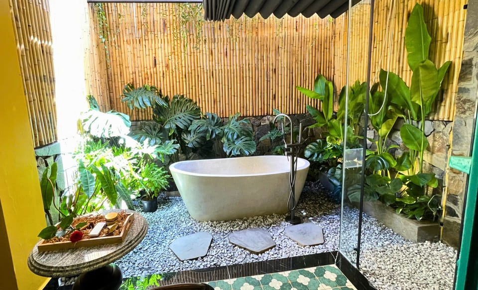 Premium Double Room, 1 King Bed, Garden Area | Bathroom | Hair dryer, slippers, towels, shampoo