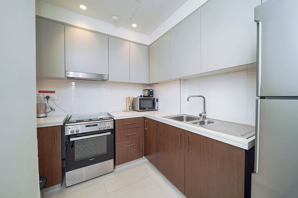 Luxury Apartment, Balcony, City View | Private kitchen | Full-size fridge, microwave, oven, stovetop