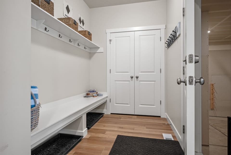 Drop your gear and get cozy—mudroom entry from the garage offers bench seating, boot storage, and coat hooks to keep things tidy.