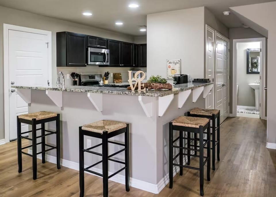 Kitchen open to living. 1/2 bath down