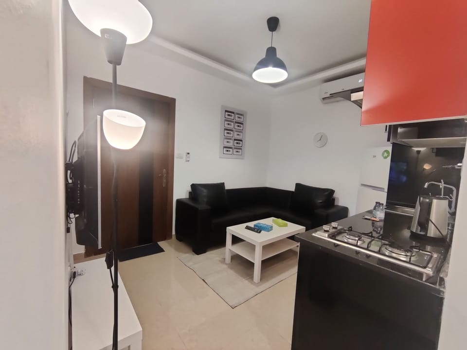Apartment, 1 Bedroom, Accessible, Smoking | Living room | Flat-screen TV