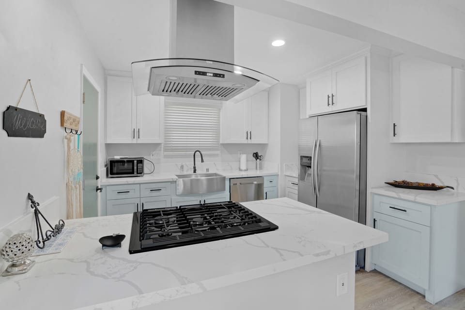 Fully Stocked Kitchen with all new appliances, large farm sink, and granite tops