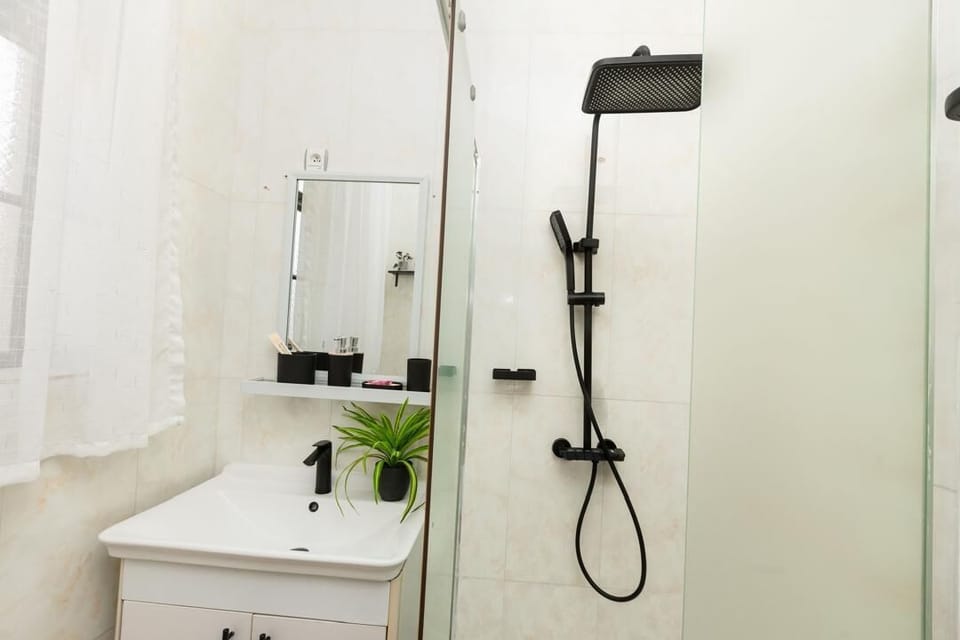 Comfort Room | Bathroom | Hair dryer, slippers, towels, soap