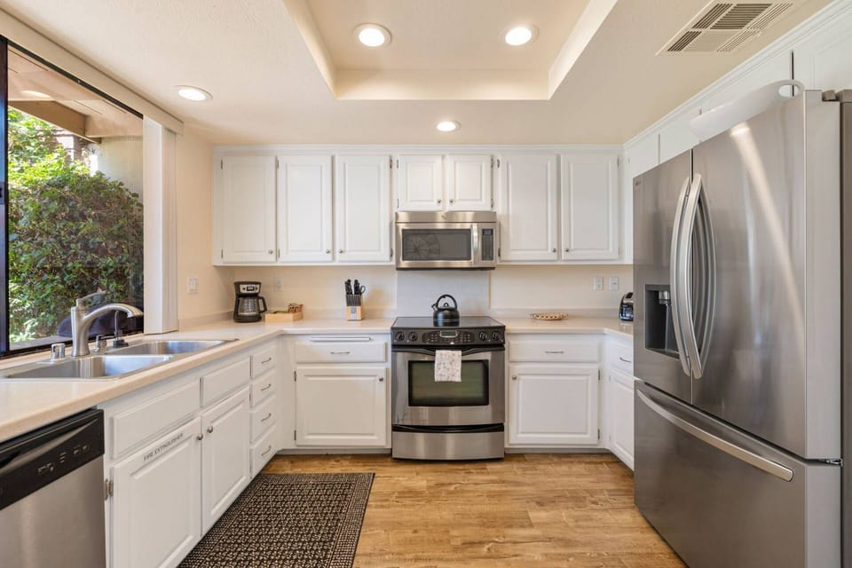Open Kitchen With Stainless Steele Appliances
