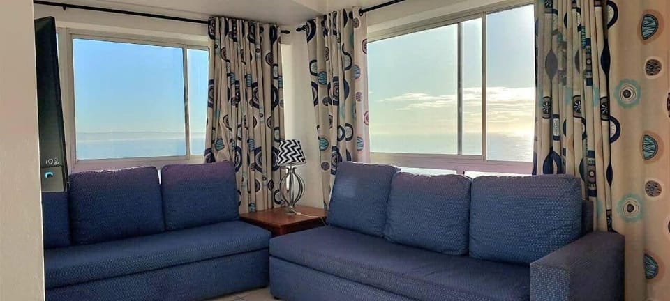 Deluxe Apartment, Sea View | Living area | TV