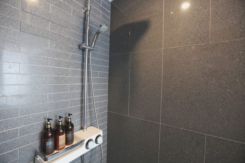 Hair dryer, slippers, towels, soap